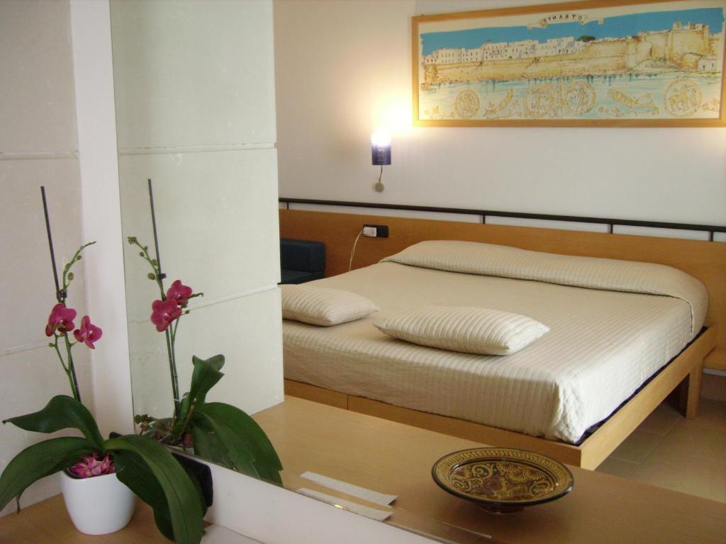 Postel nebo postele na pokoji v ubytování Hotel Degli Haethey