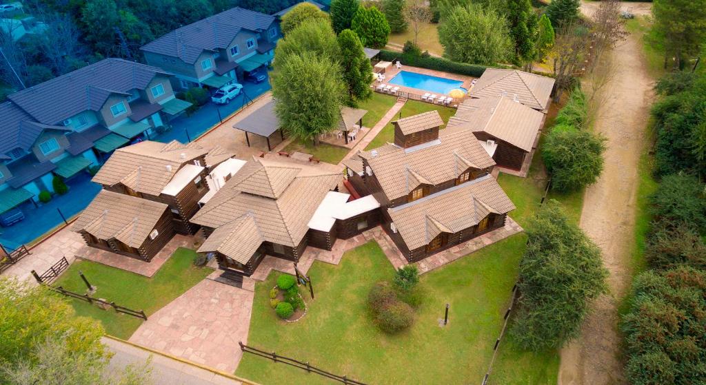an aerial view of a house with a swimming pool at Posada Pfullendorf - Adults Only in Villa General Belgrano