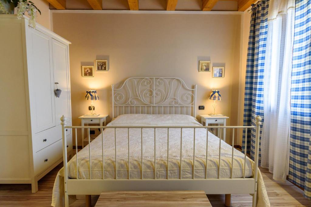 Postel nebo postele na pokoji v ubytování Ca' Dei Coci B&B