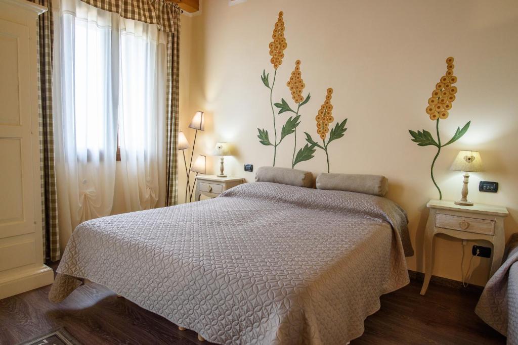 Postel nebo postele na pokoji v ubytování Ca' Dei Coci B&B
