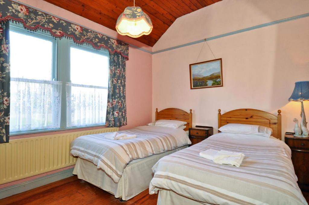 Postel nebo postele na pokoji v ubytování Boffin Lodge Guest House