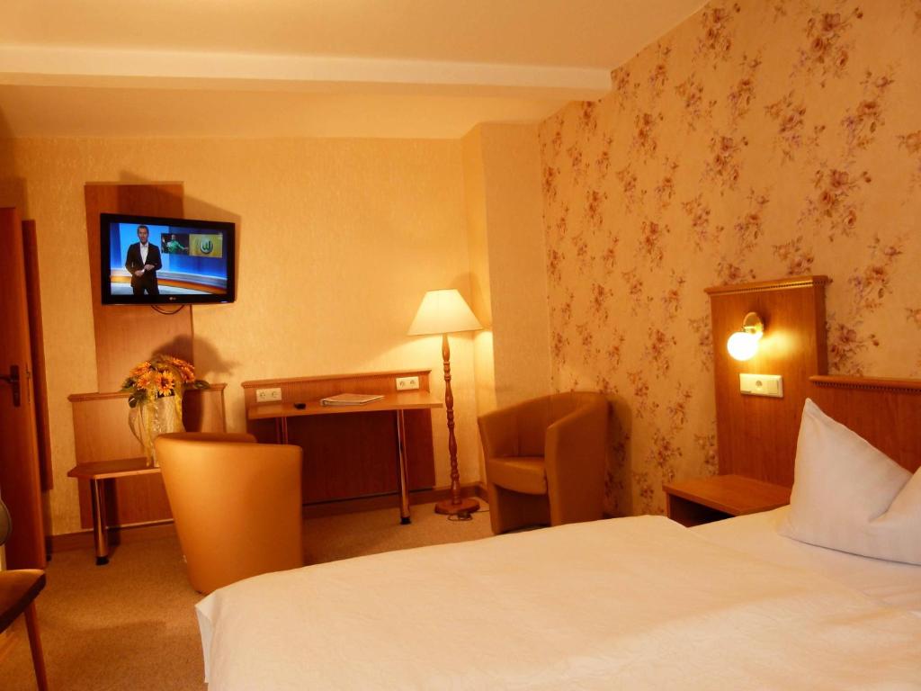 Postel nebo postele na pokoji v ubytování Hotel & Gasthof Garküche