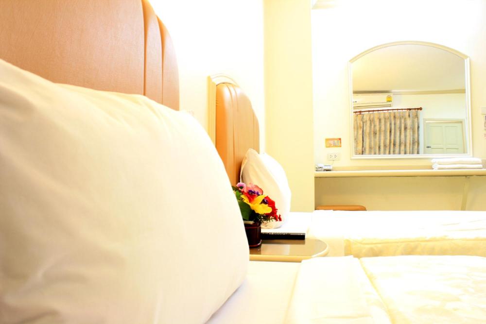 Postel nebo postele na pokoji v ubytování P.A. Ville Hotel