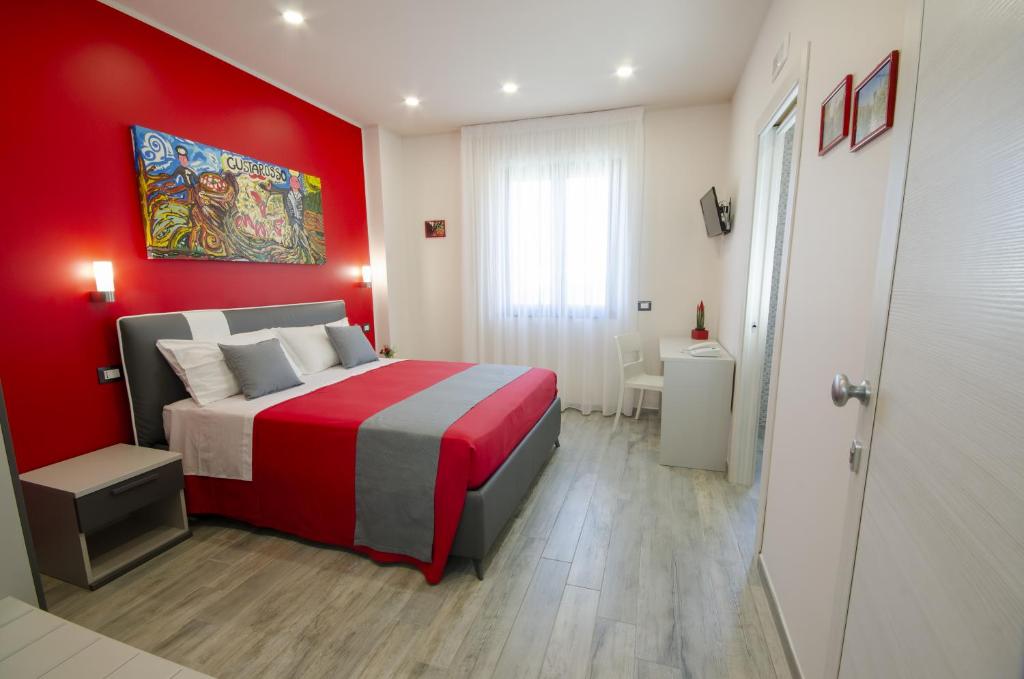 Łóżko lub łóżka w pokoju w obiekcie Gustarosso Rooms