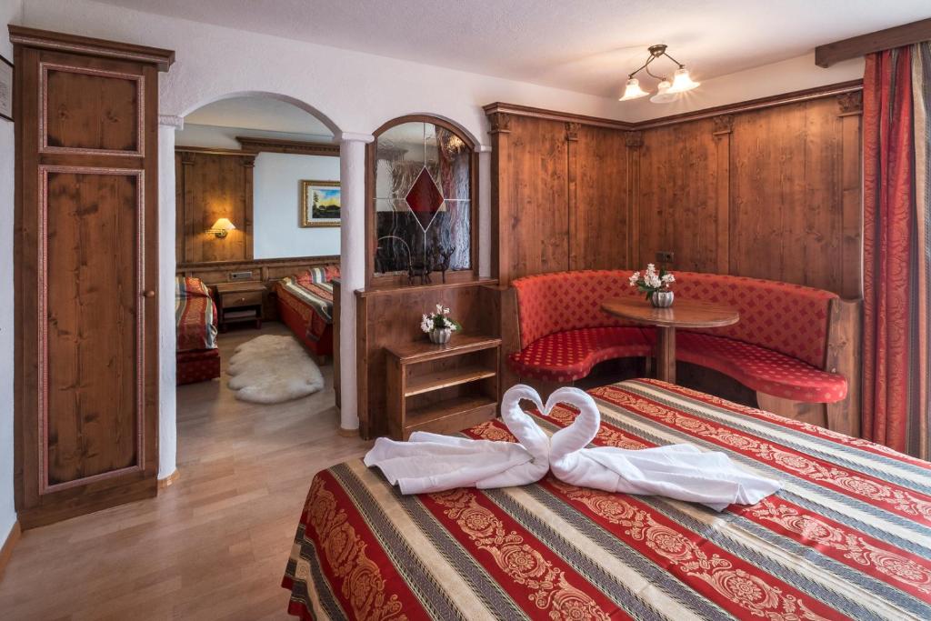 Postel nebo postele na pokoji v ubytování Hotel Serena