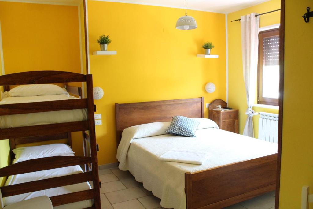 Postel nebo postele na pokoji v ubytování Casa Mita