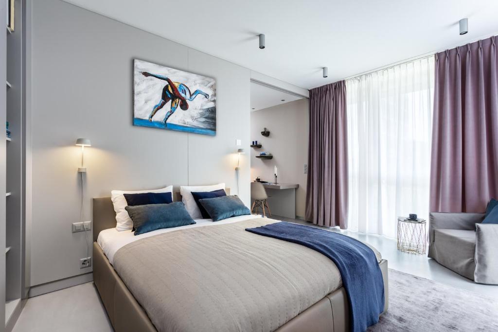 Postel nebo postele na pokoji v ubytování VISIONAPARTMENTS St Sulpice - contactless check-in