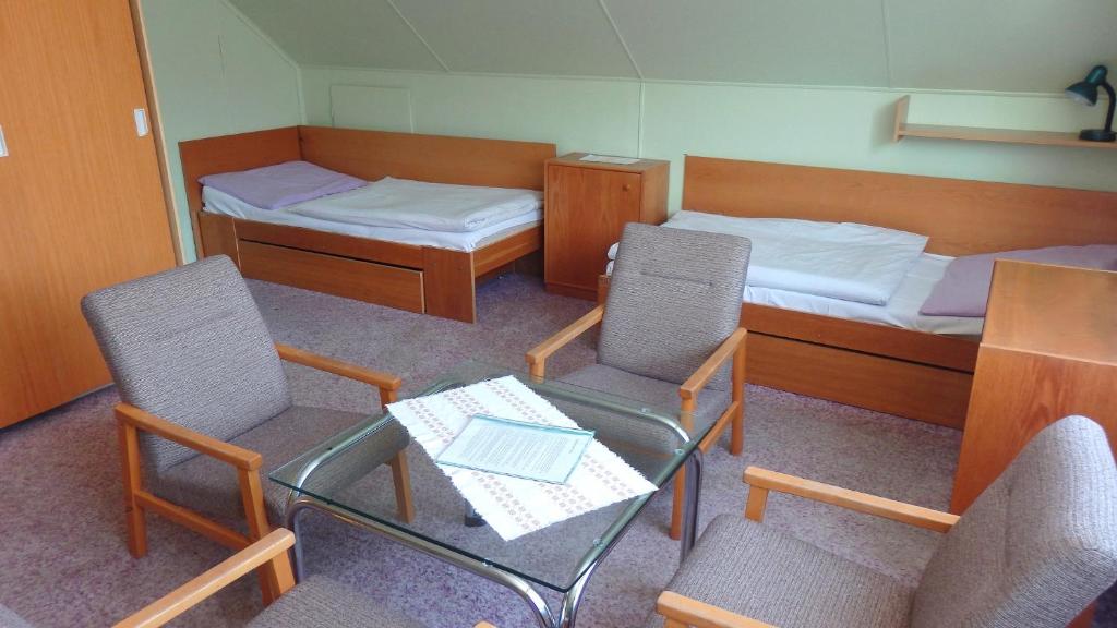 Postel nebo postele na pokoji v ubytování Chaty Kotárky