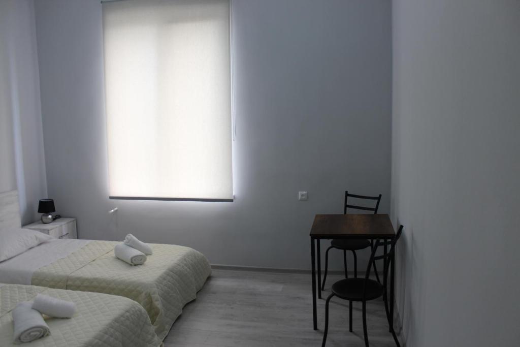 Postel nebo postele na pokoji v ubytování Kvara's House