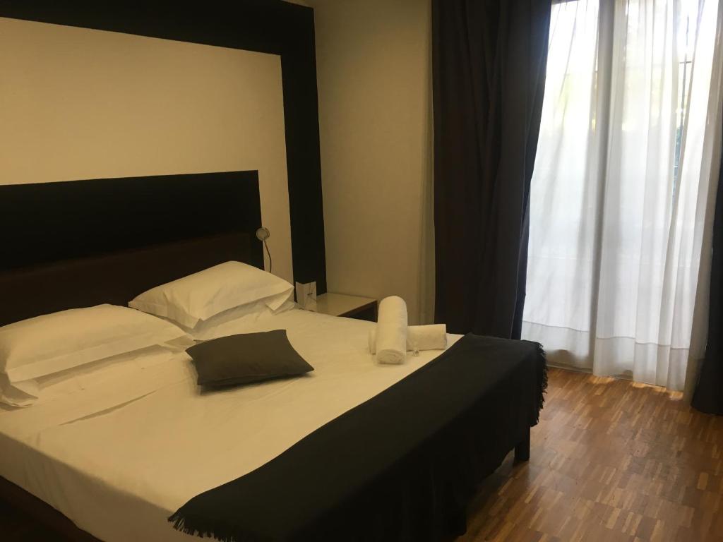 Postel nebo postele na pokoji v ubytování Black Hotel