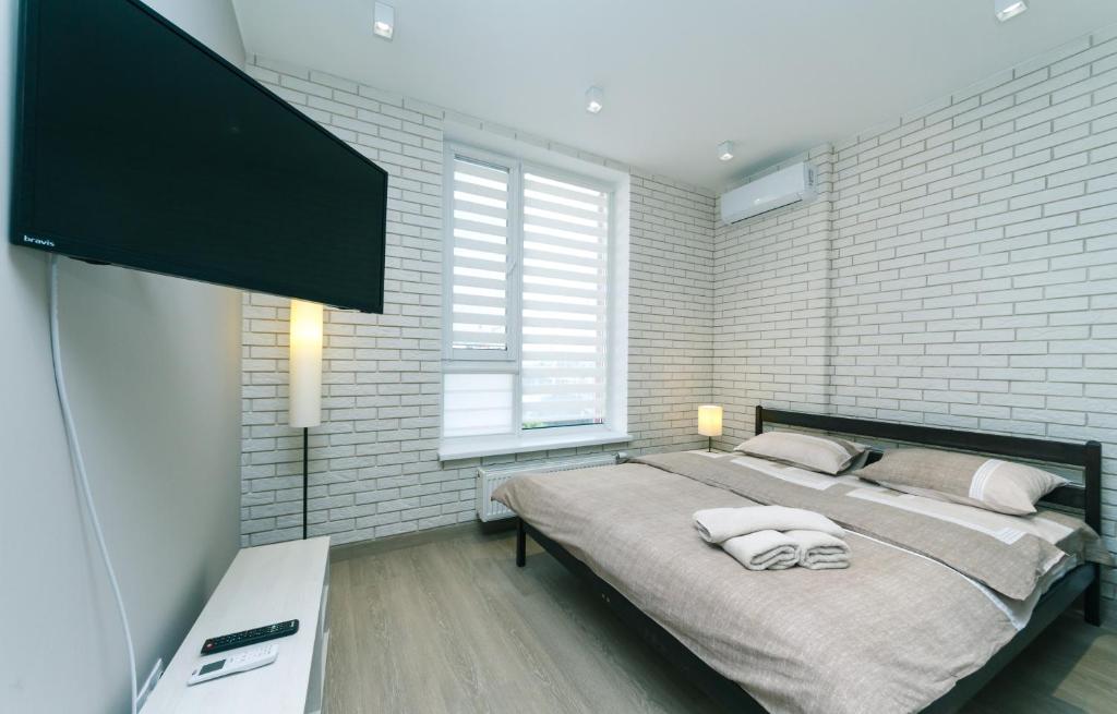 Televízia a/alebo spoločenská miestnosť v ubytovaní Comfort Town apartment