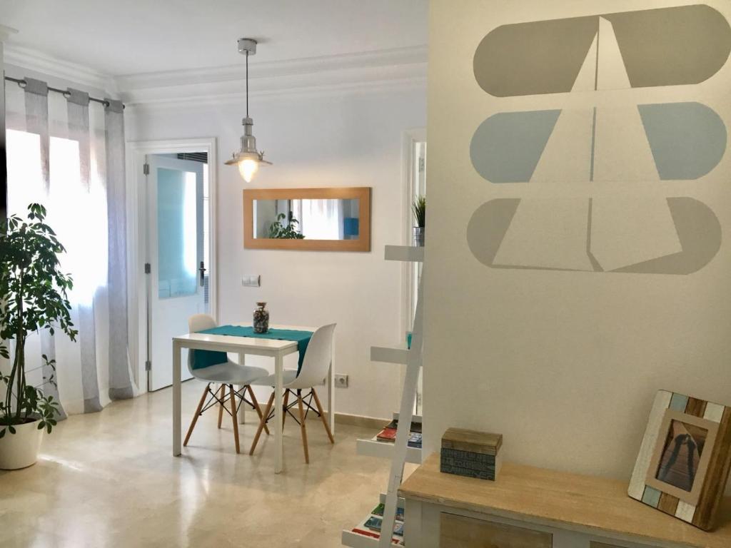a dining room with a table and chairs at Apartamento beach house in Las Palmas de Gran Canaria
