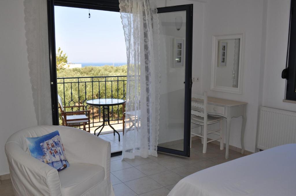 A bed or beds in a room at Nefeli Villas
