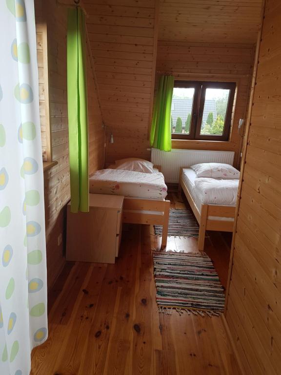 Postel nebo postele na pokoji v ubytování Cztery Pory Roku