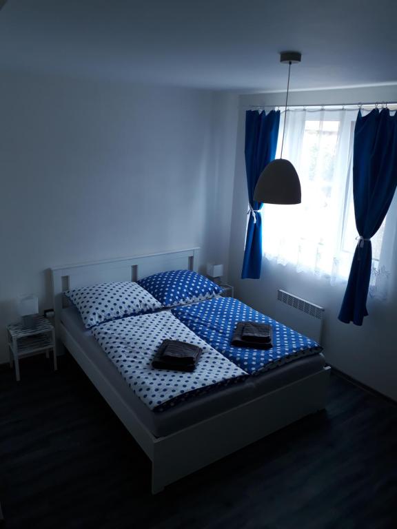 Postel nebo postele na pokoji v ubytování Apartmán Na Pekárně