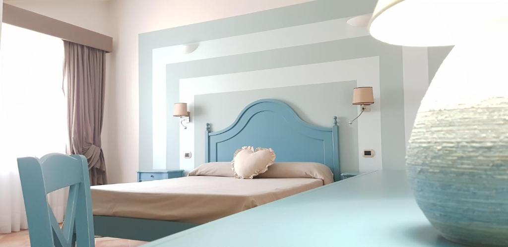 Postel nebo postele na pokoji v ubytování Anima Antiqua Relais & Spa