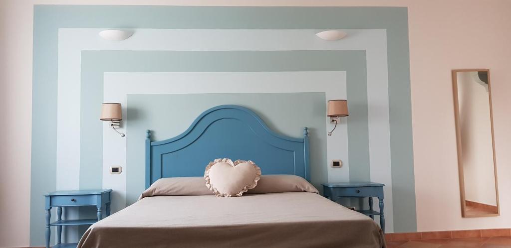 Postel nebo postele na pokoji v ubytování Anima Antiqua Relais & Spa