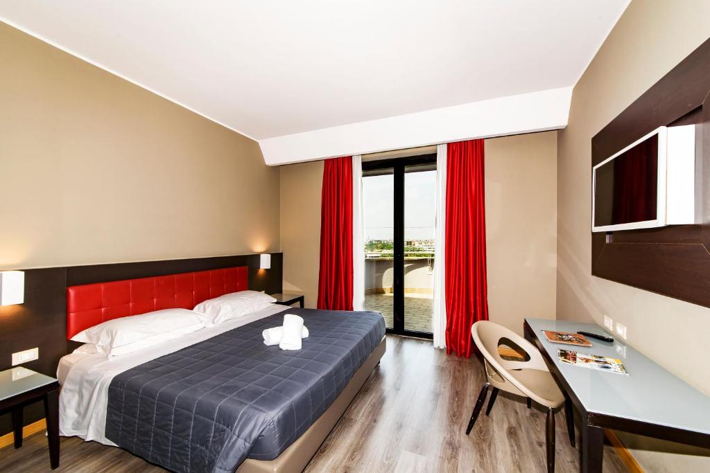 Postel nebo postele na pokoji v ubytování Hotel Da Vinci