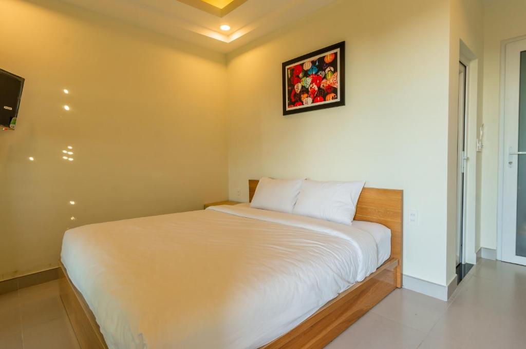 Cama o camas de una habitación en D Central Hoi An Homestay
