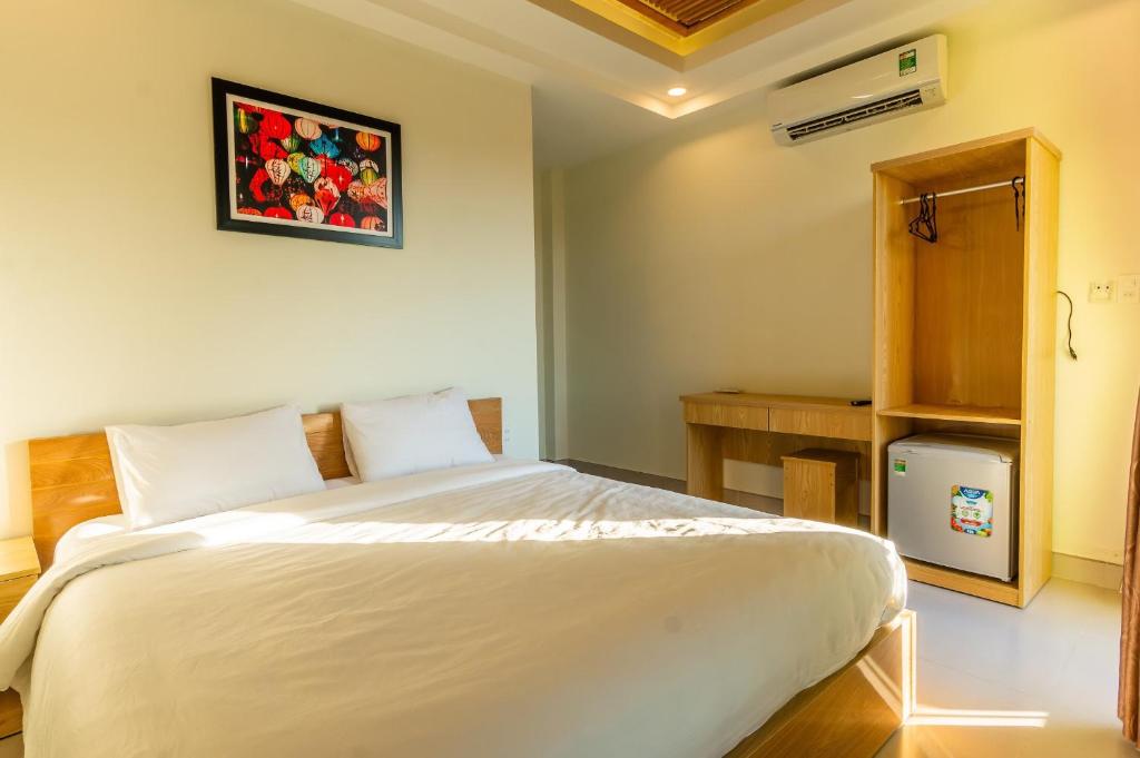 Cama o camas de una habitación en D Central Hoi An Homestay