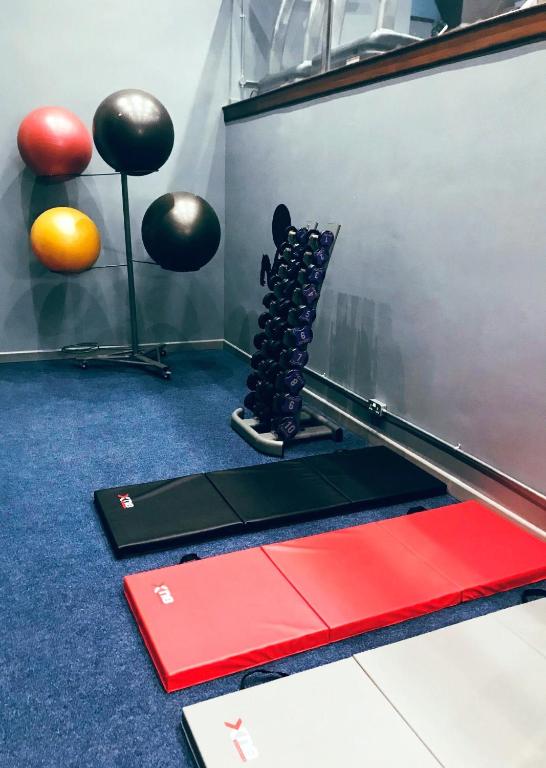 a bowling alley with a rack of pins and balls at Cumberland Hotel - OCEANA COLLECTION in Bournemouth