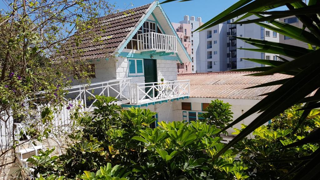 a house with a balcony on top of a building at ZORBAS Sea View No 4 in Larnaca