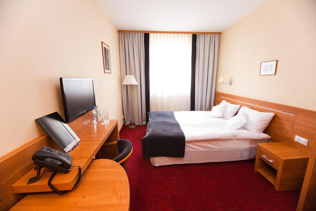 TV a/nebo společenská místnost v ubytování Hotel Malinowski Business