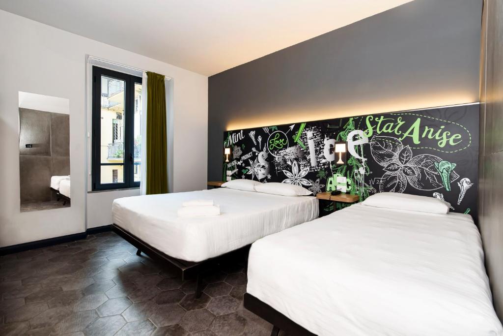 Postel nebo postele na pokoji v ubytování Spice Hotel Milano