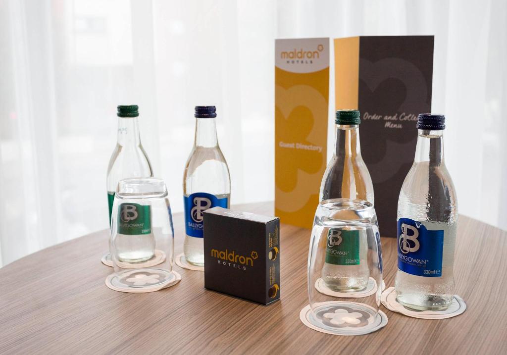 a group of wine bottles sitting on top of a table at Maldron Hotel Kevin Street, Dublin City in Dublin