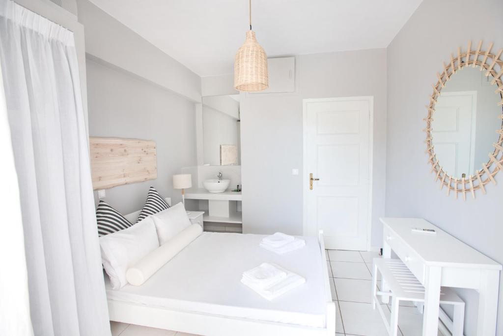 Postel nebo postele na pokoji v ubytování Akra Morea Hotel & Residences