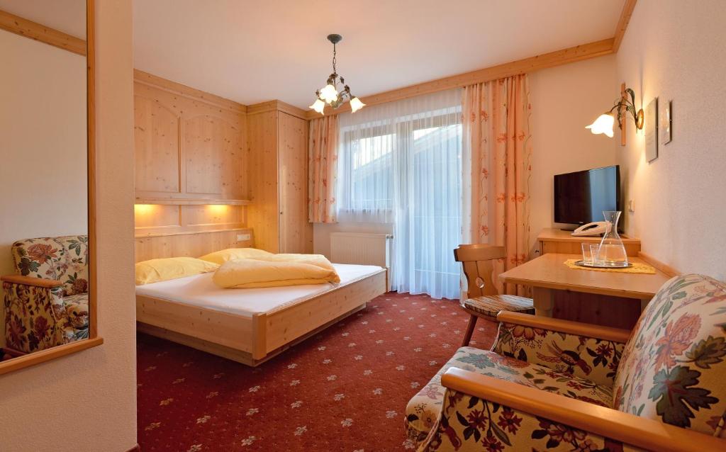 Postel nebo postele na pokoji v ubytování Hotel Garberwirt
