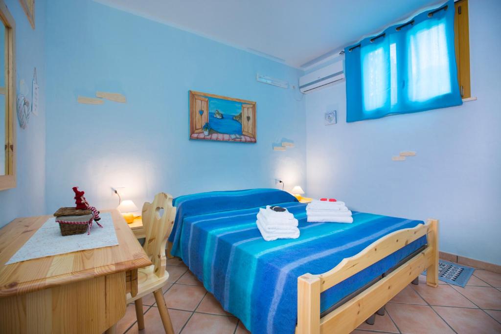 Postel nebo postele na pokoji v ubytování B&B La Baita Del Sud