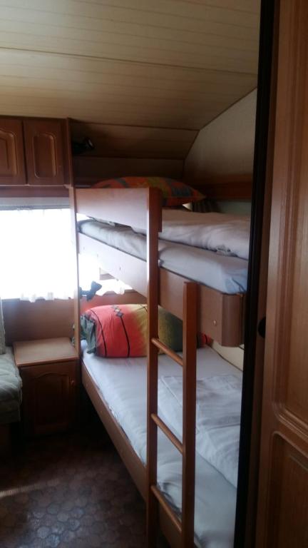 Postel nebo postele na pokoji v ubytování Caravans Magda