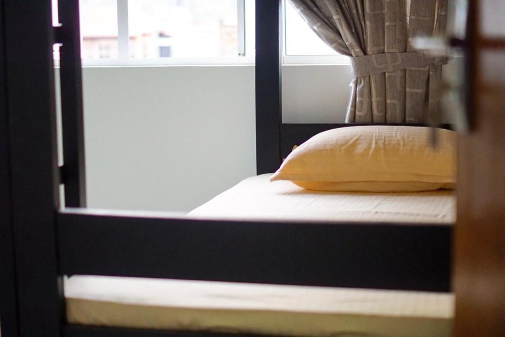 Postel nebo postele na pokoji v ubytování White Rose Hostel