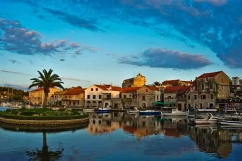 a view of a harbor with boats in the water at Apartments Lošotovi Vrboska in Vrboska