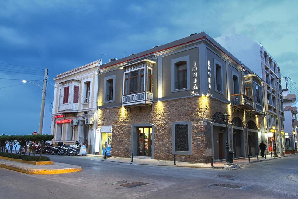 a building on the side of a street at Ionia rooms in Chios