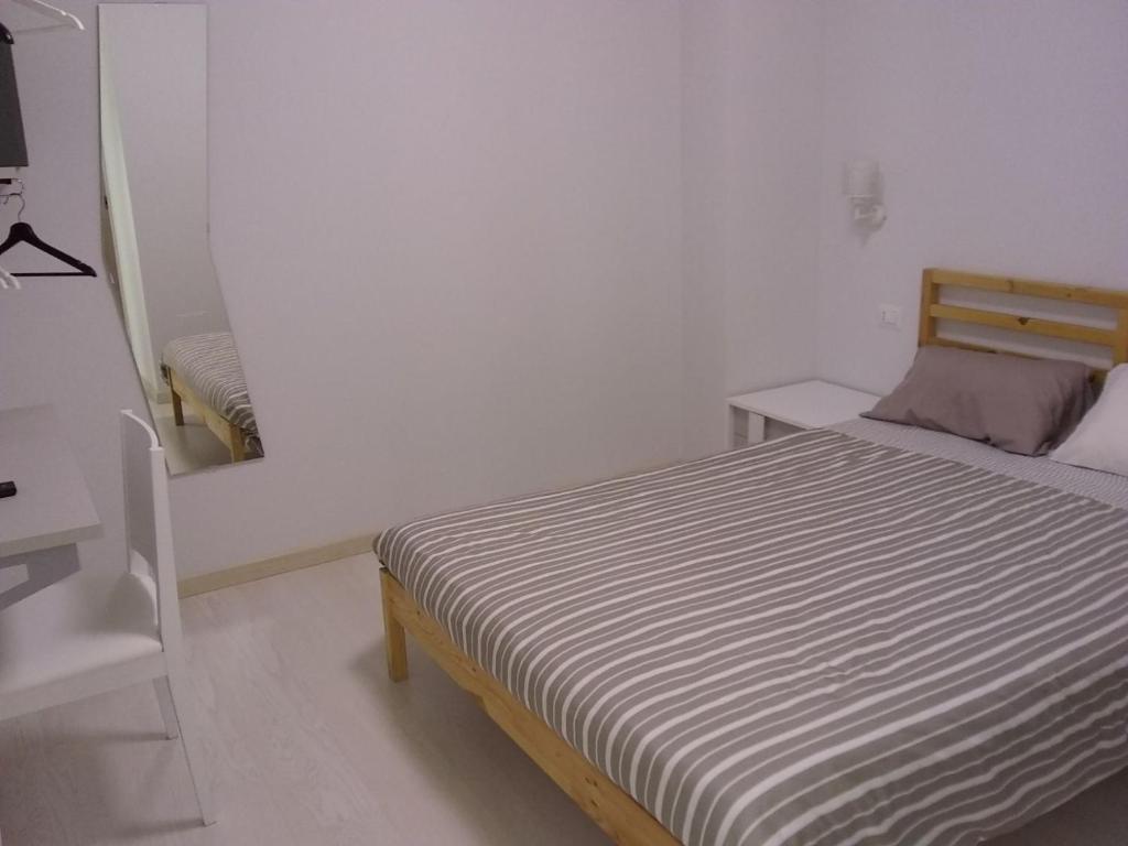 Postel nebo postele na pokoji v ubytování I Gelsomini