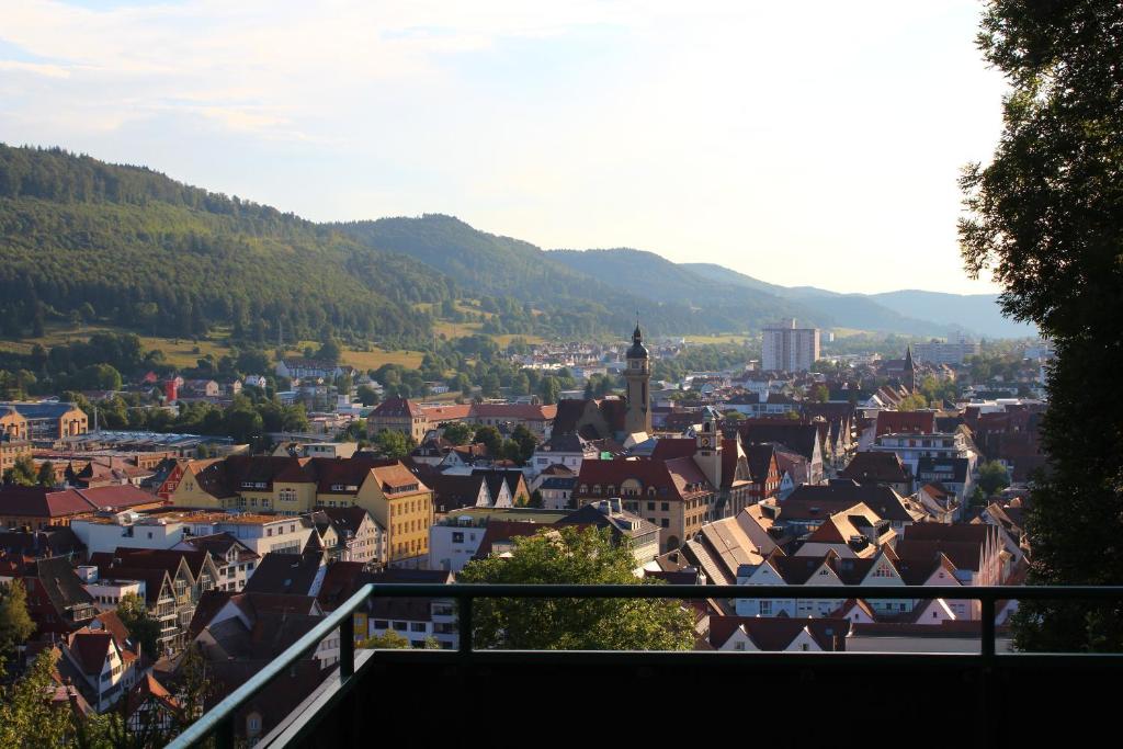a view of a town with mountains in the background at Residenz am Schloßberg in Albstadt