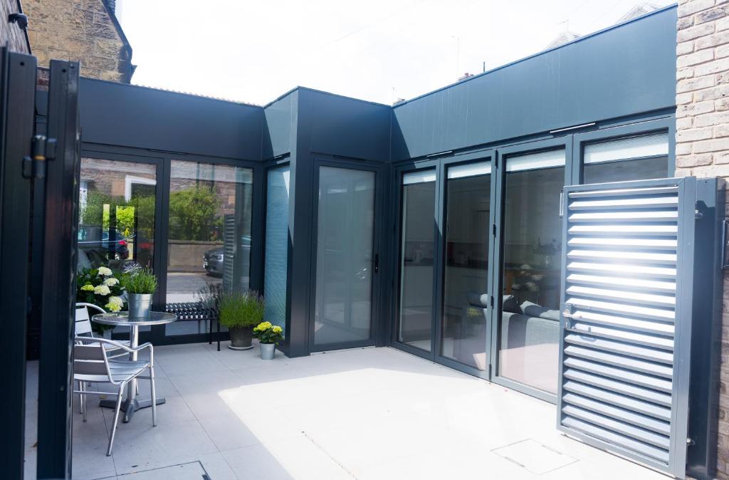 an extension to a house with sliding glass doors at Gillespie House in Edinburgh