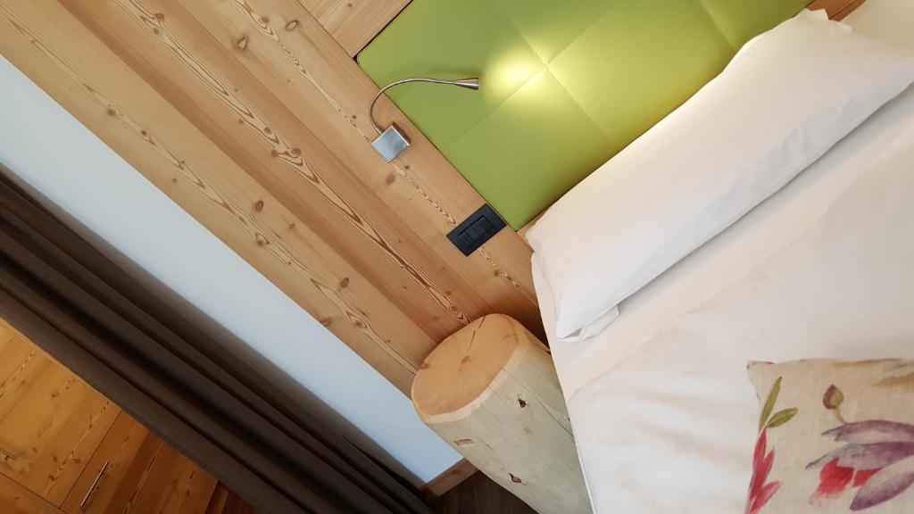 Postel nebo postele na pokoji v ubytování Garnì Stella Alpina