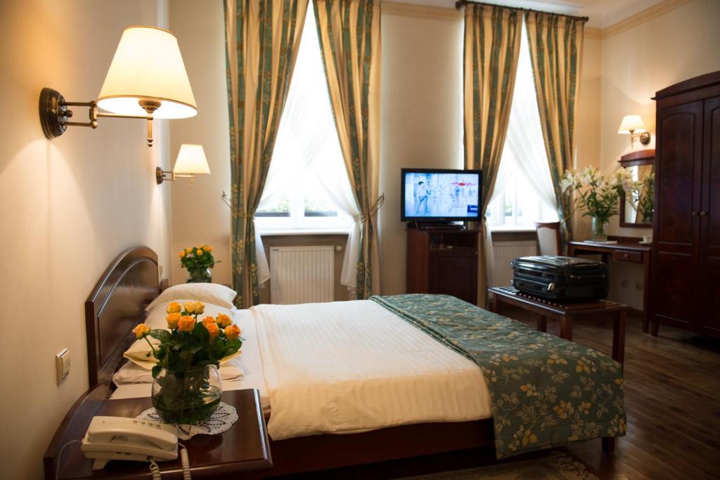 Posteľ alebo postele v izbe v ubytovaní Aparthotel Karmel