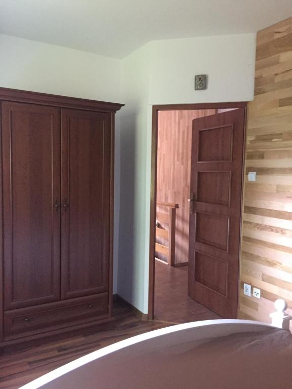 Postel nebo postele na pokoji v ubytování Apartament na Wzgórzu