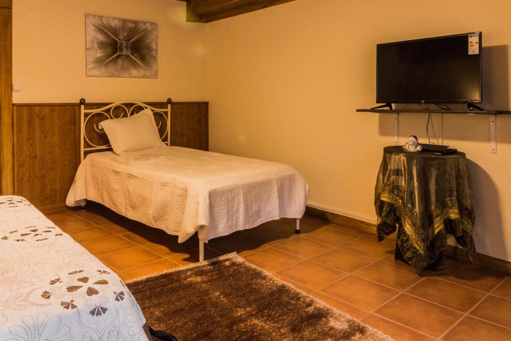 Uma cama ou camas num quarto em Portantiqua, guest house