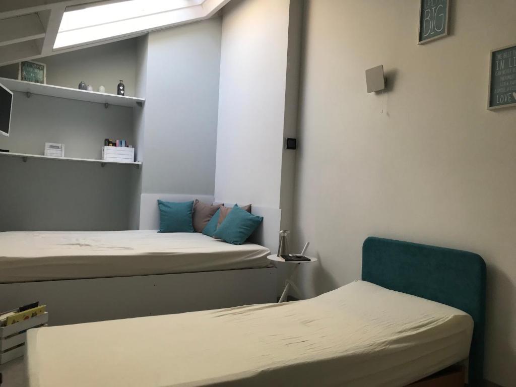 Posteľ alebo postele v izbe v ubytovaní Appartamento Vittore
