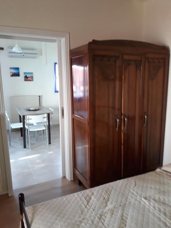 Postel nebo postele na pokoji v ubytování Atrium - Lafkos