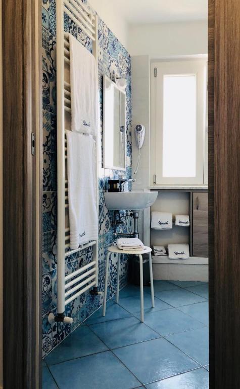 a bathroom with a sink and a mirror at Nereide in Tropea