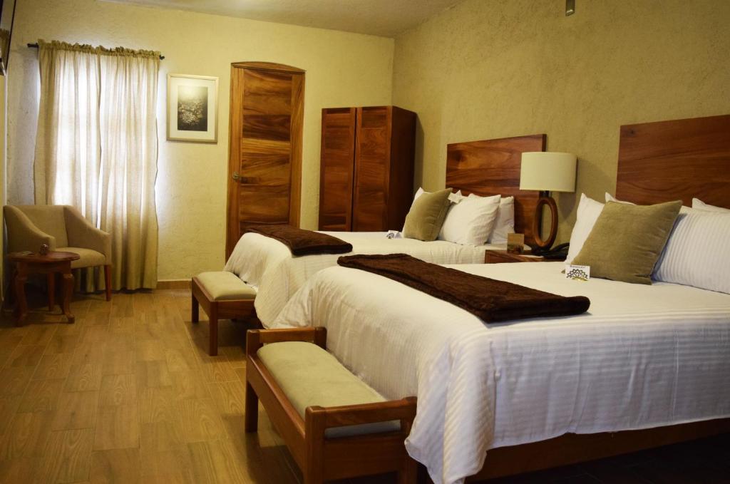 Postel nebo postele na pokoji v ubytování Hotel Casa Andaria