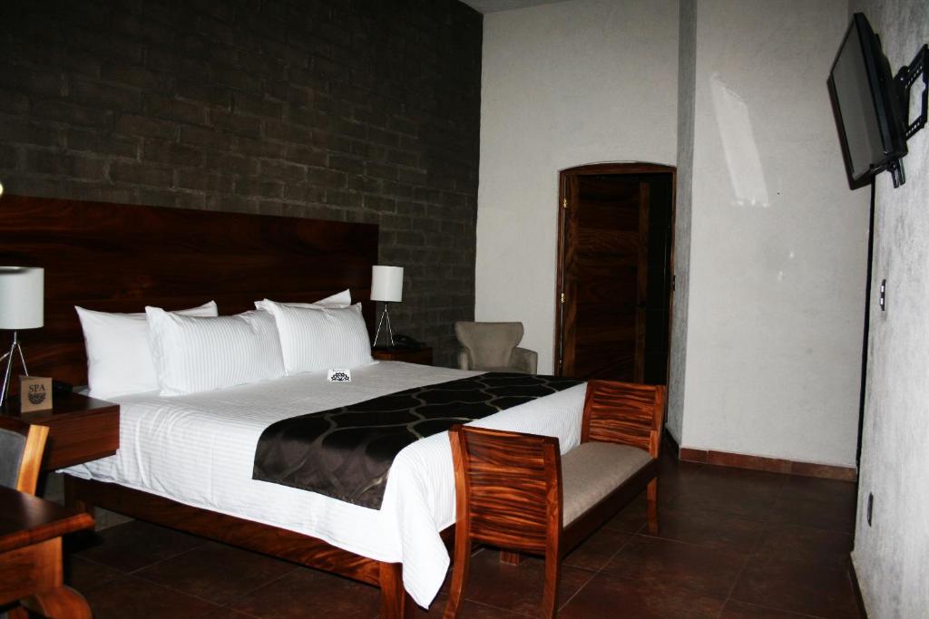 Postel nebo postele na pokoji v ubytování Hotel Casa Andaria