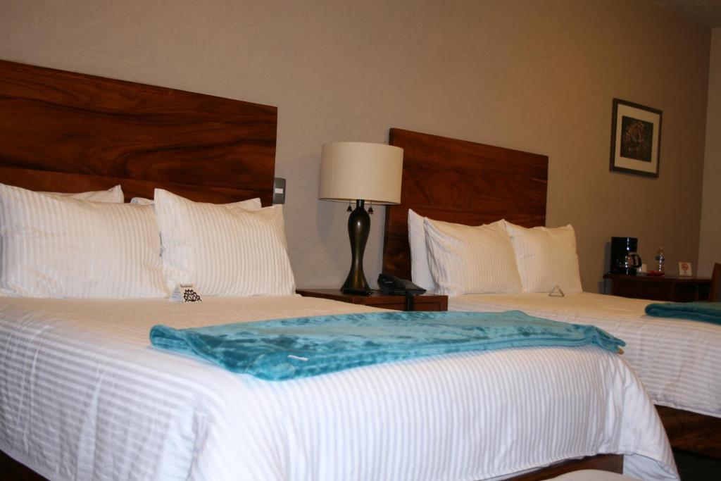 Postel nebo postele na pokoji v ubytování Hotel Casa Andaria