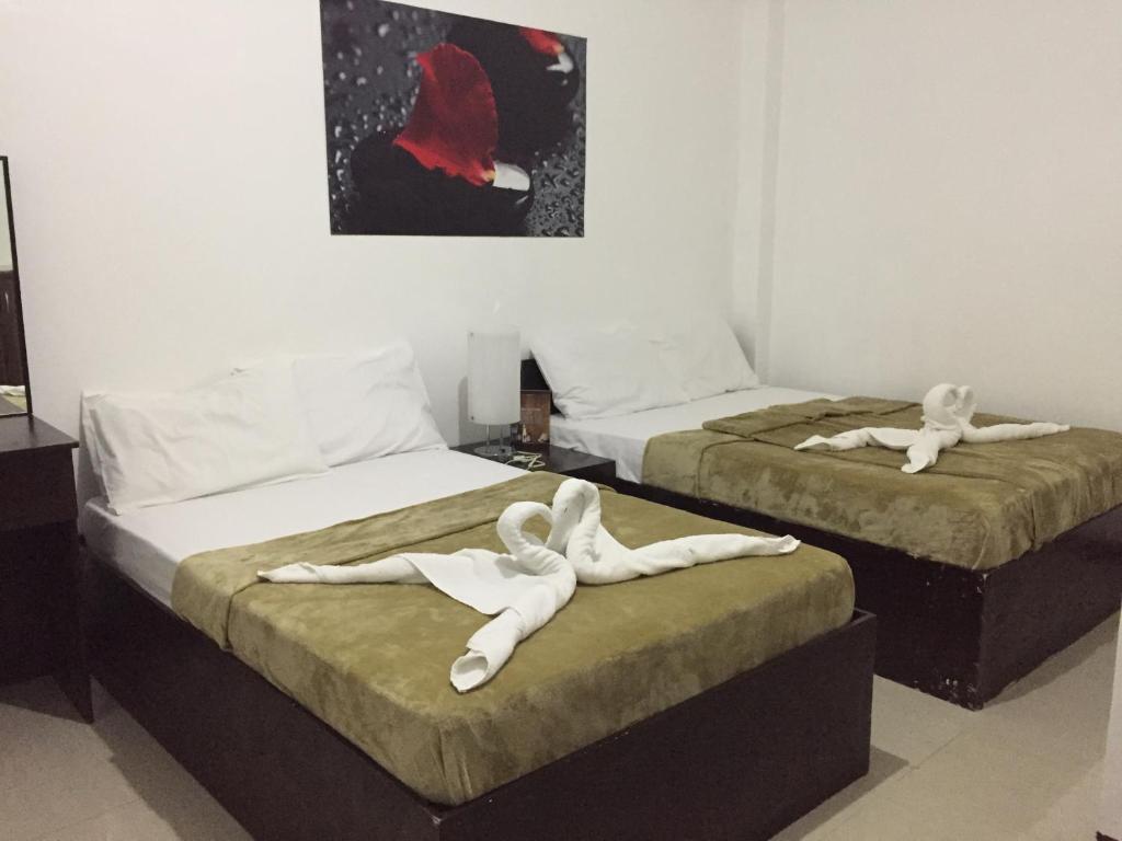 Postel nebo postele na pokoji v ubytování 4C's Tourist Lodge